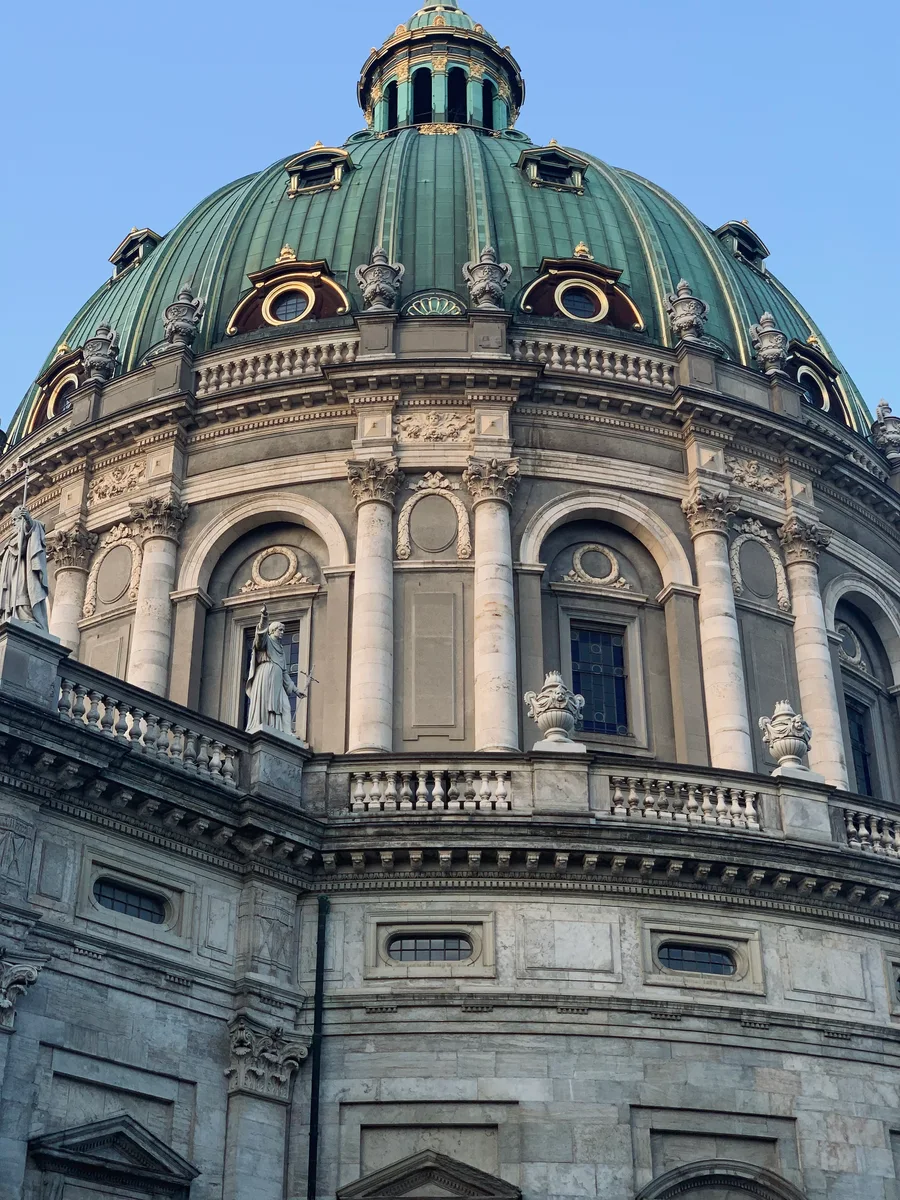 The copper dome of Frederik’s Church beneath a blue sky