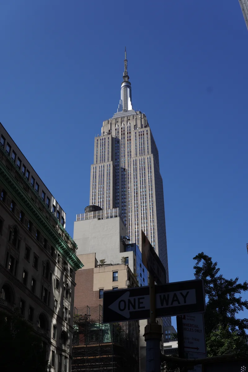 The Empire State Building rising above a Manhattan street