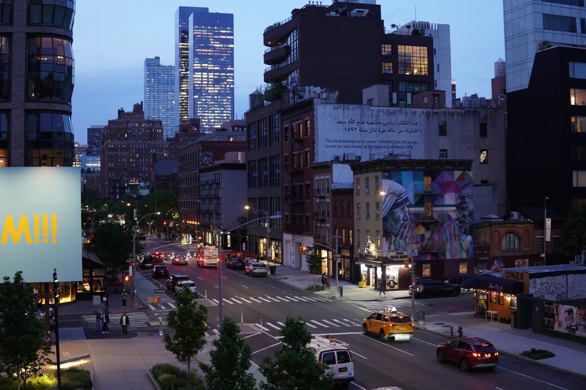Yellow taxis on a Manhattan avenue at dusk